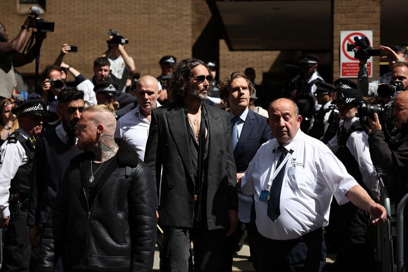 British comedian and actor Russell Brand (C) leaves following a hearing at Southwark Crown Court in south London on May 30, 2025. Brand pleaded not guilty to five charges of rape and sexual assault. The media personality turned anti-establishment influencer faces one count of rape, one of oral rape, two of sexual assault and one of indecent assault in the UK between 1999 and 2005, involving four women. (Photo by HENRY NICHOLLS / AFP) (Photo by HENRY NICHOLLS/AFP via Getty Images)