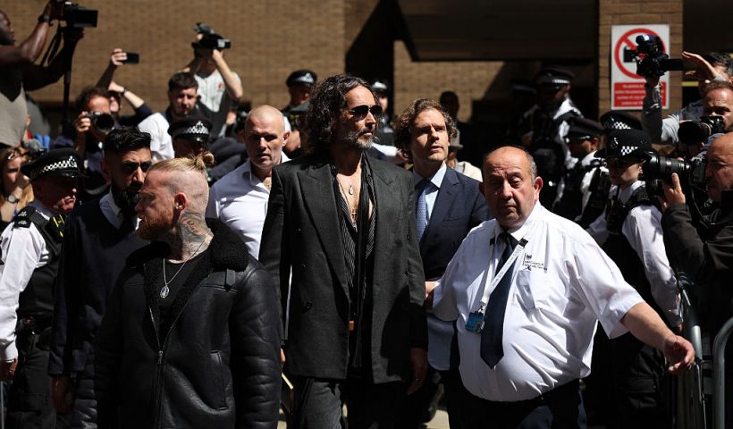 British comedian and actor Russell Brand (C) leaves following a hearing at Southwark Crown Court in south London on May 30, 2025. Brand pleaded not guilty to five charges of rape and sexual assault. The media personality turned anti-establishment influencer faces one count of rape, one of oral rape, two of sexual assault and one of indecent assault in the UK between 1999 and 2005, involving four women. (Photo by HENRY NICHOLLS / AFP) (Photo by HENRY NICHOLLS/AFP via Getty Images)