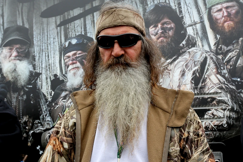 FORT WORTH, TX - APRIL 05: Reality TV personality Phil Robertson greets fans in the Duck Commander Compound at Texas Motor Speedway on April 5, 2014 in Fort Worth, Texas. (Photo by Jerry Markland/Getty Images for Texas Motor Speedway)