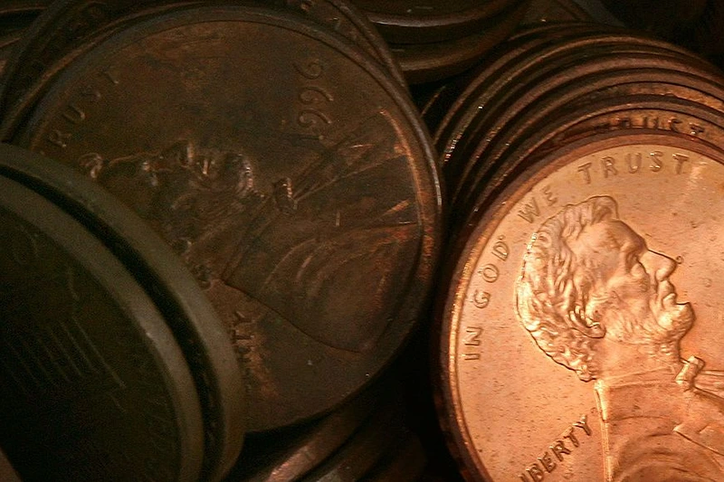 DES PLAINES, IL - JULY 06: Pennies lay in a pile July 6, 2006 in Des Plaines, Illinois. According to the U.S. Mint says a penny costs more to make than it's worth, 1.2 cents, prompting some to call for its demise. (Photo Illustration by Tim Boyle/Getty Images)