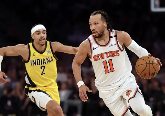New York Knicks guard Jalen Brunson (11) controls the ball against Indiana Pacers guard Andrew Nembhard (2) in the fourth quarter during game five of the eastern conference finals for the 2025 NBA Playoffs at Madison Square Garden. Mandatory Credit: Vincent Carchietta-Imagn Images