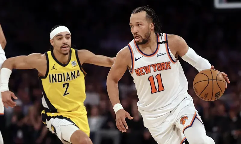 New York Knicks guard Jalen Brunson (11) controls the ball against Indiana Pacers guard Andrew Nembhard (2) in the fourth quarter during game five of the eastern conference finals for the 2025 NBA Playoffs at Madison Square Garden. Mandatory Credit: Vincent Carchietta-Imagn Images