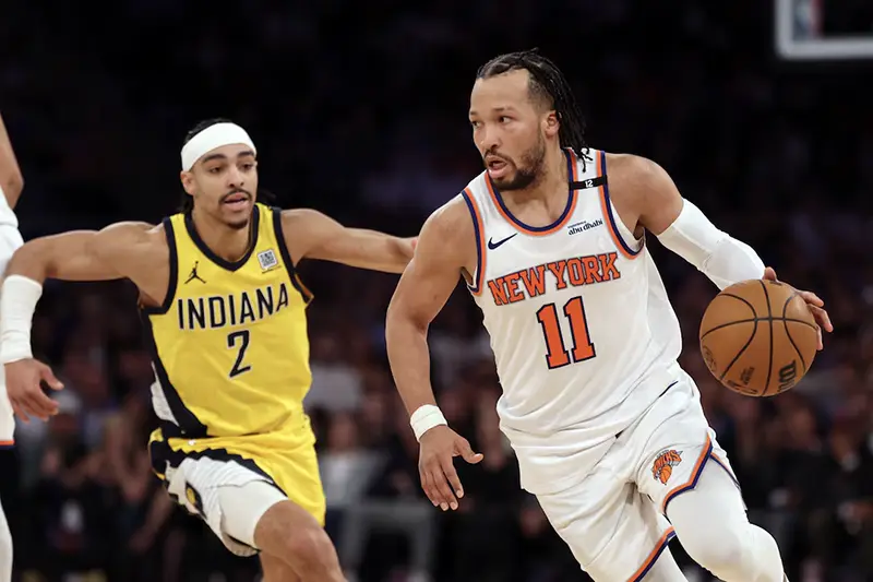 New York Knicks guard Jalen Brunson (11) controls the ball against Indiana Pacers guard Andrew Nembhard (2) in the fourth quarter during game five of the eastern conference finals for the 2025 NBA Playoffs at Madison Square Garden. Mandatory Credit: Vincent Carchietta-Imagn Images