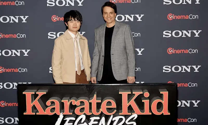 Ben Wang and Ralph Macchio, pose as they promote the upcoming movie "Karate Kid: Legends," before a Sony Pictures presentation at CinemaCon, the official convention of Cinema United, in Las Vegas, Nevada, U.S. March 31, 2025. REUTERS/Steve Marcus/File Photo
