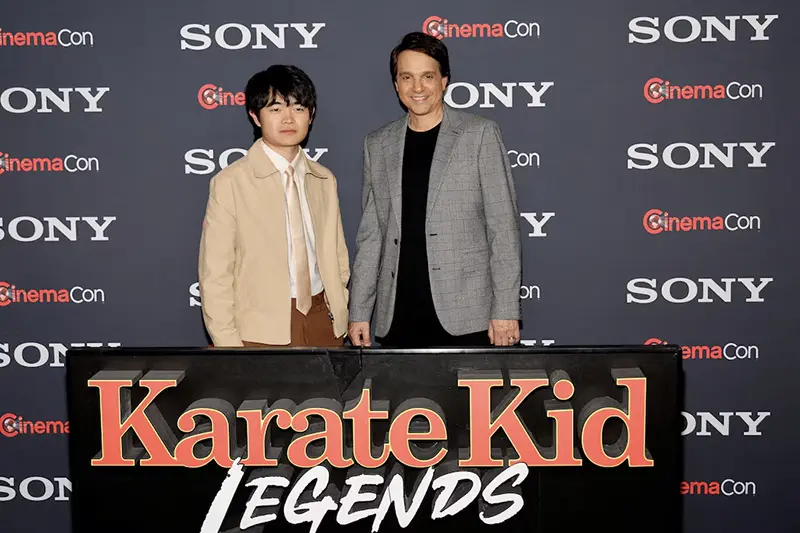 Ben Wang and Ralph Macchio, pose as they promote the upcoming movie "Karate Kid: Legends," before a Sony Pictures presentation at CinemaCon, the official convention of Cinema United, in Las Vegas, Nevada, U.S. March 31, 2025. REUTERS/Steve Marcus/File Photo