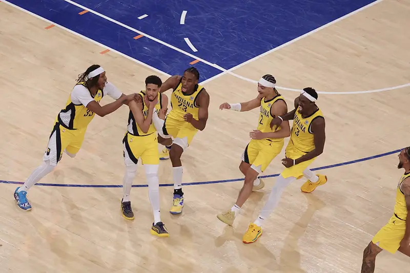 Indiana Pacers guard Tyrese Haliburton (0) celebrates with teammates after tying the game in the fourth quarter to send the game to overtime against the New York Knicks during game one of the eastern conference finals for the 2025 NBA Playoffs at Madison Square Garden. Mandatory Credit: Brad Penner-Imagn Images