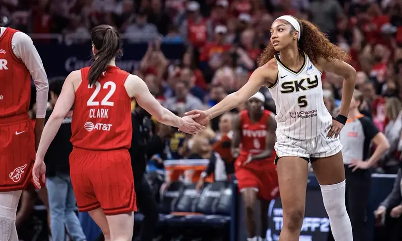 Indiana Fever guard Caitlin Clark (22) and Chicago Sky forward Angel Reese (5) shake hands before the game at Gainbridge Fieldhouse. Mandatory Credit: Trevor Ruszkowski-Imagn Images/File Photo