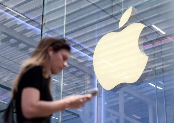 A person walks by the Apple store on Fifth Avenue in New York City, U.S., May 1, 2025. REUTERS/Kylie Cooper/File Photo