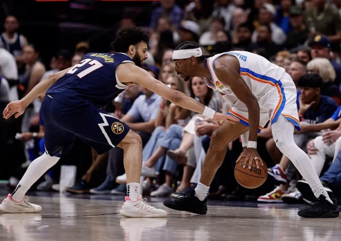 Oklahoma City Thunder guard Shai Gilgeous-Alexander (2) controls the ball as Denver Nuggets guard Jamal Murray (27) guards in the third quarter during game four of the second round of the 2025 NBA Playoffs at Ball Arena. Mandatory Credit: Isaiah J. Downing-Imagn Images