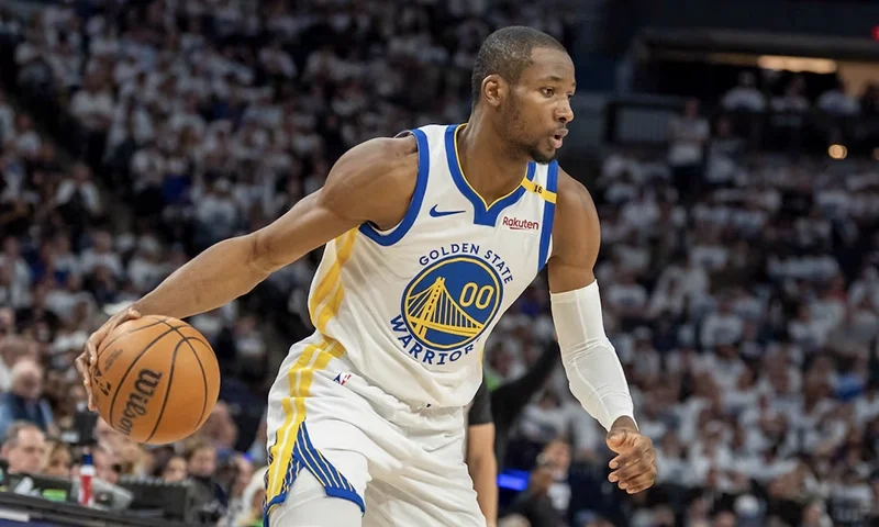 Golden State Warriors forward Jonathan Kuminga (00) dribbles the ball against the Minnesota Timberwolves in the second half during game two of the second round for the 2025 NBA Playoffs at Target Center. Mandatory Credit: Jesse Johnson-Imagn Images