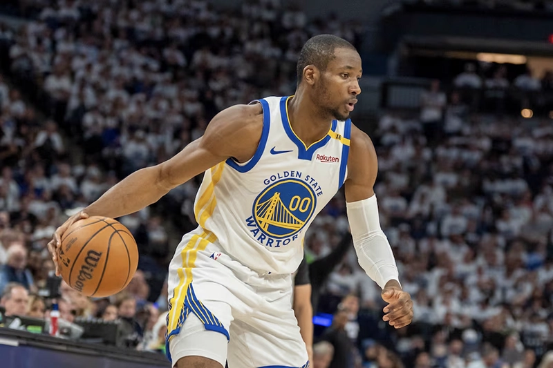 Golden State Warriors forward Jonathan Kuminga (00) dribbles the ball against the Minnesota Timberwolves in the second half during game two of the second round for the 2025 NBA Playoffs at Target Center. Mandatory Credit: Jesse Johnson-Imagn Images
