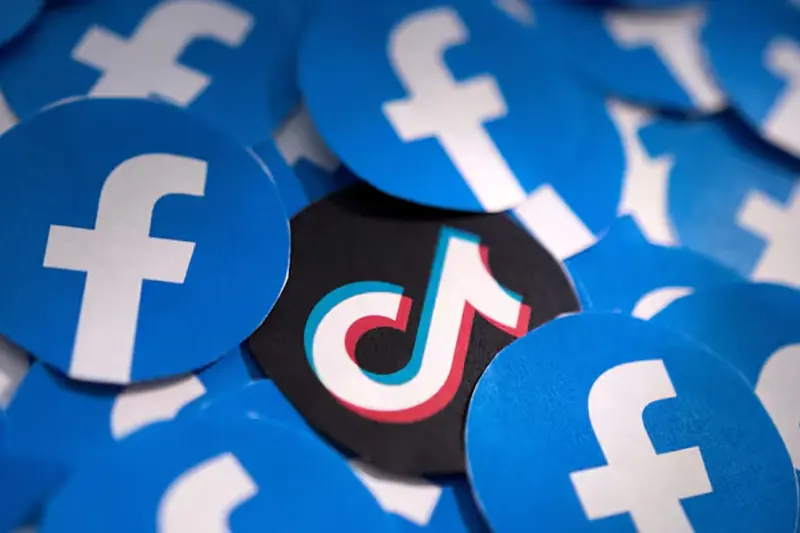 Printed Facebook and TikTok logos are seen in this illustration taken February 15, 2022. REUTERS/Dado Ruvic/Illustration/File Photo