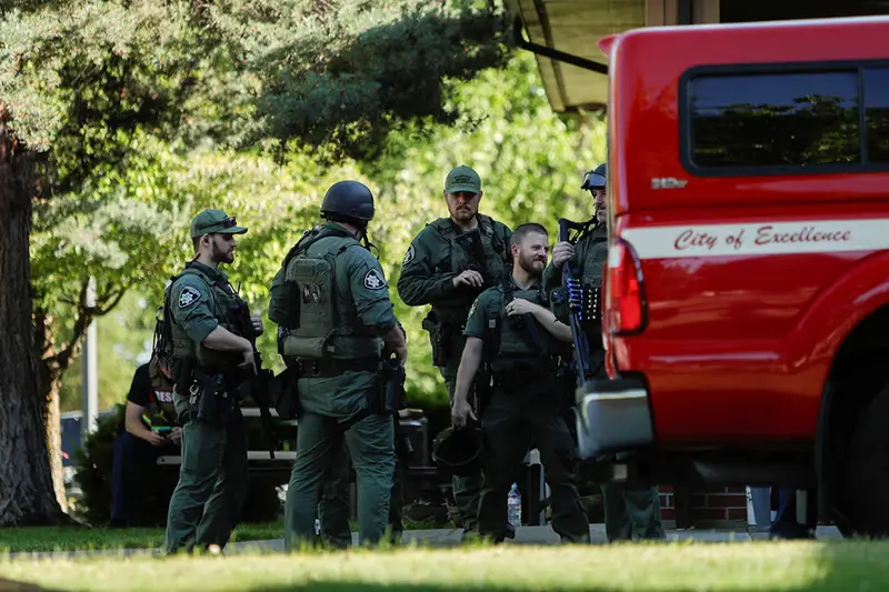 Law enforcement officers gather at Cherry Hill Park after multiple firefighters were attacked when responding to a fire in the Canfield Mountain area outside Coeur d’Alene, Idaho, U.S. June 29, 2025. REUTERS/Young Kwak