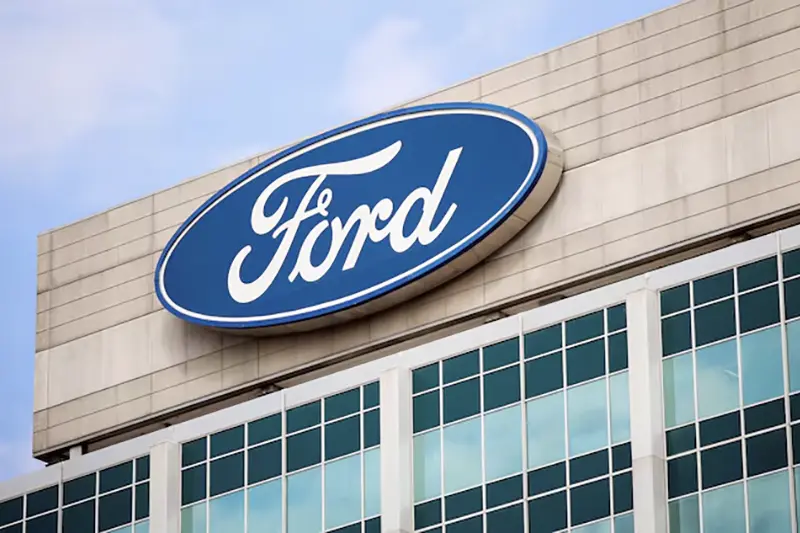 A Ford logo is seen on the Ford Motor World headquarters in Dearborn, Michigan, U.S., March 12, 2025. REUTERS/Rebecca Cook