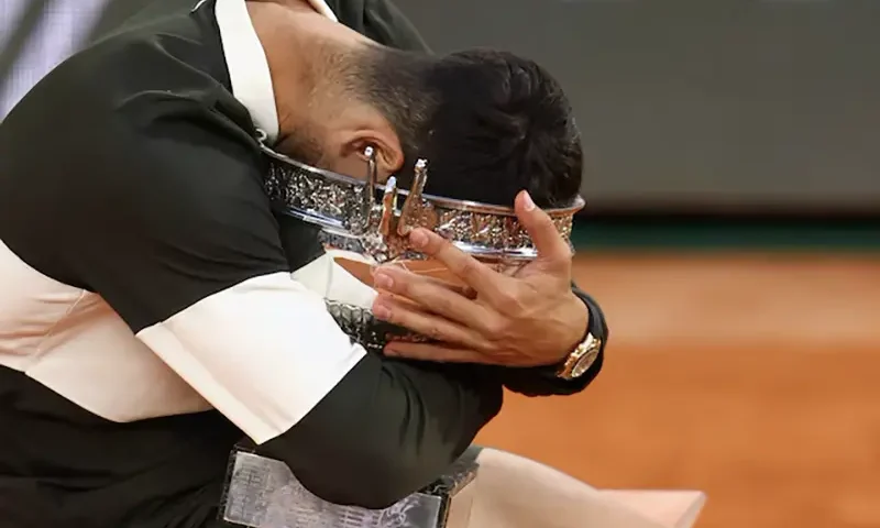 Spain's Carlos Alcaraz celebrates with the trophy after winning the men's singles final against Italy's Jannik Sinner in the French Open final, in Paris, June 8. REUTERS/Lisi Niesner/File Photo