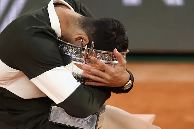 Spain's Carlos Alcaraz celebrates with the trophy after winning the men's singles final against Italy's Jannik Sinner in the French Open final, in Paris, June 8. REUTERS/Lisi Niesner/File Photo