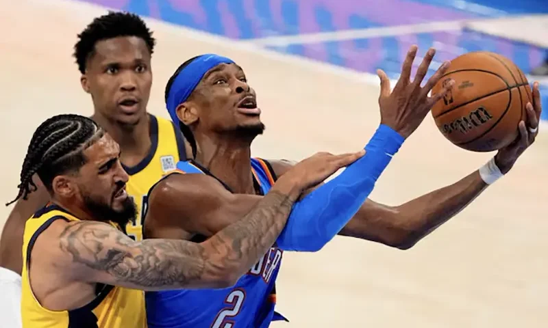 Oklahoma City Thunder guard Shai Gilgeous-Alexander (2) shoots the ball against Indiana Pacers forward Obi Toppin (1) during the second half during game two of the 2025 NBA Finals at Paycom Center. Mandatory Credit: Kyle Terada-Imagn Images