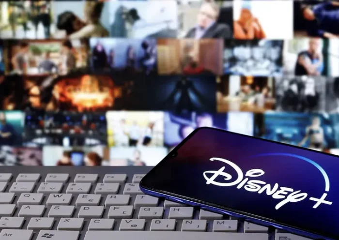 A smartphone with displayed "Disney" logo is seen on the keyboard in this illustration taken March 24, 2020. REUTERS/Dado Ruvic