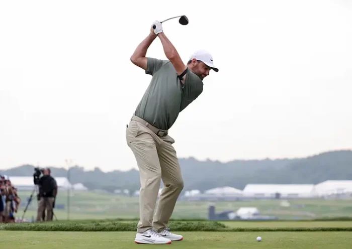 Scottie Scheffler plays his shot from the tenth tee during the second round of the U.S. Open golf tournament. Mandatory Credit: Bill Streicher-Imagn Images