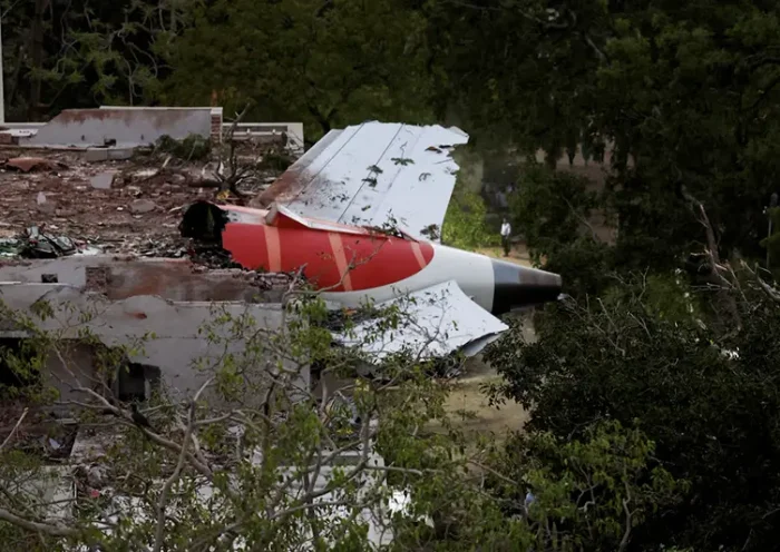 Tail of an Air India Boeing 787 Dreamliner plane that crashed is seen stuck on a building after the incident in Ahmedabad, India, June 12, 2025. REUTERS/Amit Dave/File Photo