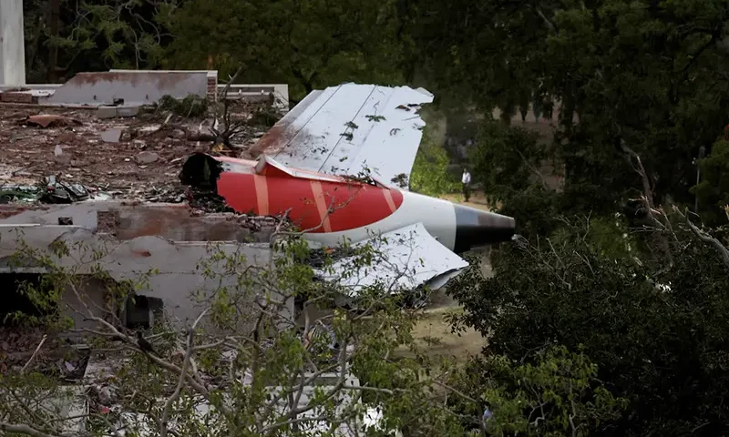 Tail of an Air India Boeing 787 Dreamliner plane that crashed is seen stuck on a building after the incident in Ahmedabad, India, June 12, 2025. REUTERS/Amit Dave/File Photo