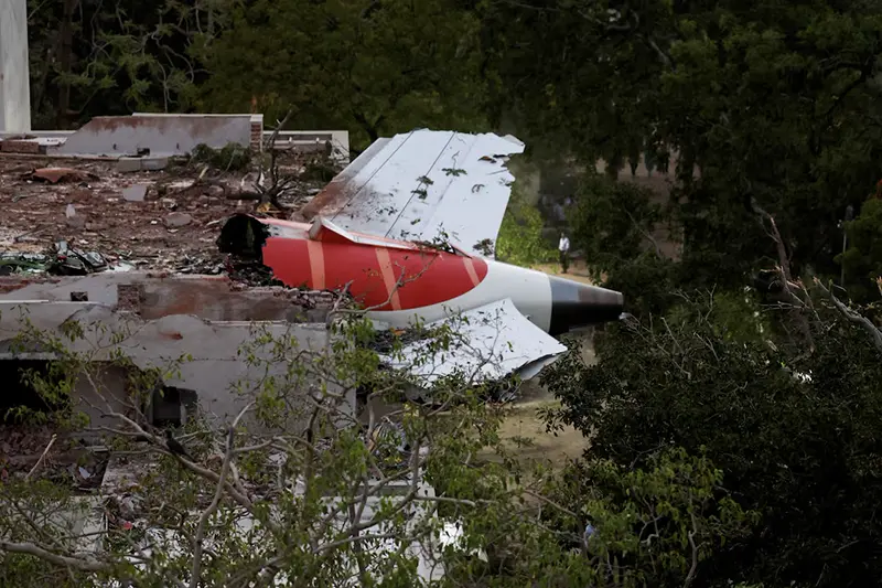 Tail of an Air India Boeing 787 Dreamliner plane that crashed is seen stuck on a building after the incident in Ahmedabad, India, June 12, 2025. REUTERS/Amit Dave/File Photo
