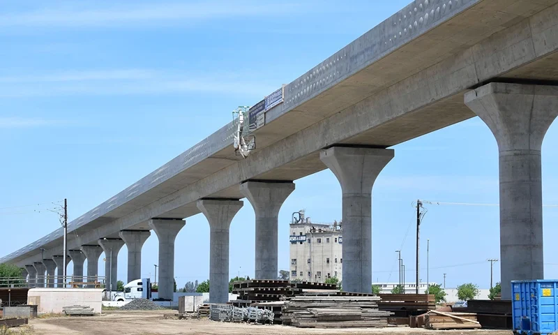 A truck crosses beneath the ongoing construction of the high-speed railway in Fresno, California, on May 8, 2019, amid ongoing construction of the railway in California's Central and San Joaquin Valleys. - In February, newly elected Governor Gavin Newsom announced that he was drastically revising downward the high-speed rail project to link Los Angeles to San Francisco in three hours, even though the plan was approved in a 2008 referendum. The federal government indicated that it was scrapping a $900 million subsidy due to "chronic" construction delays. (Photo by Frederic J. BROWN / AFP) (Photo by FREDERIC J. BROWN/AFP via Getty Images)
