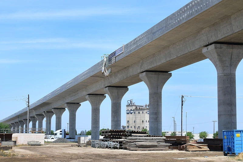 A truck crosses beneath the ongoing construction of the high-speed railway in Fresno, California, on May 8, 2019, amid ongoing construction of the railway in California's Central and San Joaquin Valleys. - In February, newly elected Governor Gavin Newsom announced that he was drastically revising downward the high-speed rail project to link Los Angeles to San Francisco in three hours, even though the plan was approved in a 2008 referendum. The federal government indicated that it was scrapping a $900 million subsidy due to "chronic" construction delays. (Photo by Frederic J. BROWN / AFP) (Photo by FREDERIC J. BROWN/AFP via Getty Images)