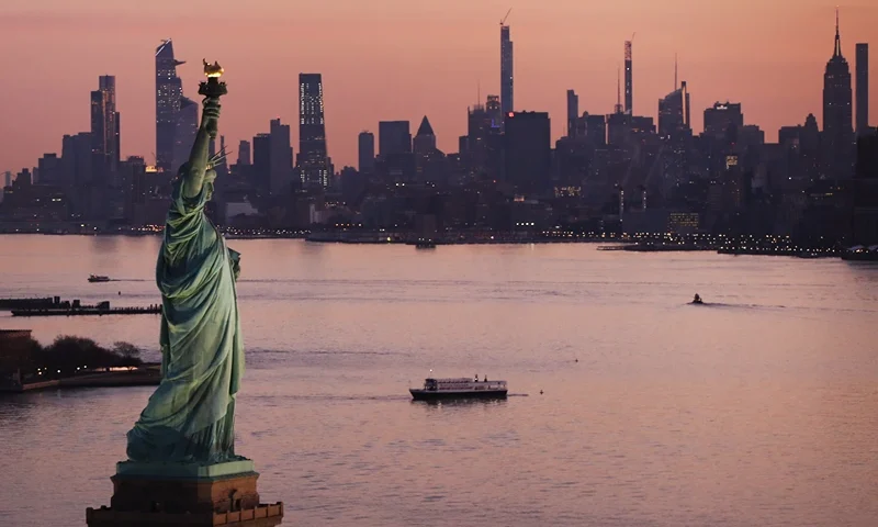 Dawn breaks over The Statue of Liberty as Manhattan and the nation struggles to contain the number of coronavirus cases on March 18, 2020 in New York City. Across the city businesses, schools and places of work have been shutting down leading to empty streets and quiet neighborhoods. New York City mayor Bill de Blasio has threatened to call for a 'shelter-in-place' order as Manhattan continues to see a rise in cases of the virus. World wide, 200,000 people have now contracted COVID-19. (Photo by Spencer Platt/Getty Images)
