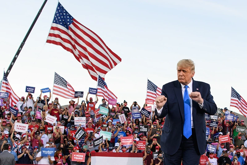 US President Donald Trump dances at the end of a rally at Carson City Airport in Carson City, Nevada on October 18, 2020. (Photo by MANDEL NGAN / AFP) (Photo by MANDEL NGAN/AFP via Getty Images)