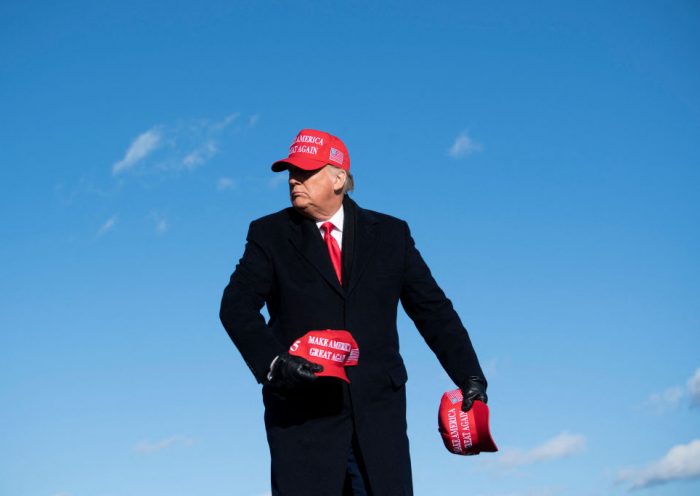TOPSHOT - US President Donald Trump throws hats to supporters during a Make America Great Again rally at Wilkes-Barre Scranton International Airport November 2, 2020, in Avoca, Pennsylvania. The US presidential campaign enters its final day Monday with a last-minute scramble for votes by Donald Trump and Joe Biden, drawing to a close an extraordinary race that has put a pandemic-stricken country on edge. (Photo by Brendan Smialowski / AFP) (Photo by BRENDAN SMIALOWSKI/AFP via Getty Images)