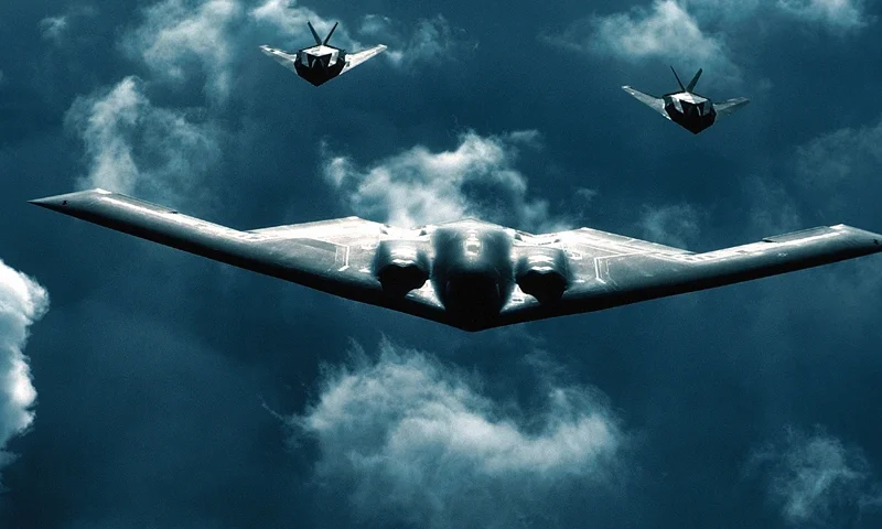 373879 01: A B-2 Spirit bomber, center, flies with two F-117A Nighthawks, July 19, 2000 above dramatic clouds. The B-2 Spirit is a multi-role bomber capable of delivering both conventional and nuclear munitions. (Photo courtesy of U.S. Air Force)