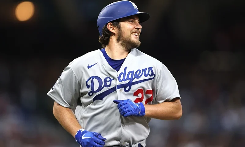 Trevor Bauer #27 of the Los Angeles Dodgers laughs after grounding out in the third inning of a game against the San Diego Padres at PETCO Park on June 23, 2021 in San Diego, California. (Photo by Sean M. Haffey/Getty Images)