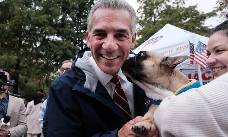 New Jersey Republican gubernatorial candidate Jack Ciattarelli gets a kiss from a pug named Romeo as he participates in a campaign event with local residents on October 27, 2021 in Hoboken, New Jersey. Ciattarelli, who is running against Democratic incumbent Phil Murphy, has promised to reduce taxes and a streamline the state budget if elected. (Photo by Spencer Platt/Getty Images)