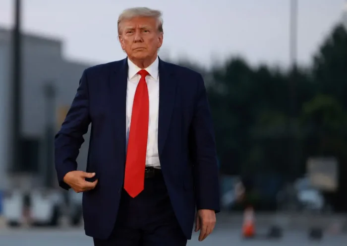 ATLANTA, GEORGIA - AUGUST 24: Former U.S. President Donald Trump arrives to depart at Atlanta Hartsfield-Jackson International Airport after being booked at the Fulton County jail on August 24, 2023 in Atlanta, Georgia. Trump was booked on multiple charges related to an alleged plan to overturn the results of the 2020 presidential election in Georgia. (Photo by Joe Raedle/Getty Images)