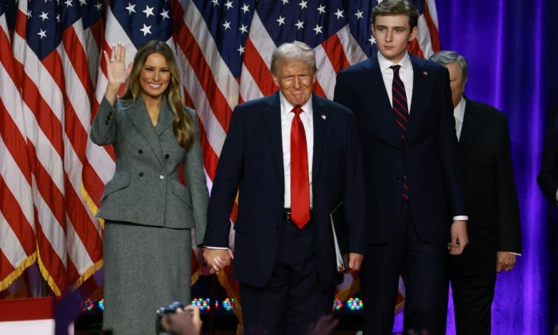 Donald Trump arrives to speak with former first lady Melania Trump and Barron Trump during an election night event at the Palm Beach Convention Center on November 06, 2024 in West Palm Beach, Florida. (Photo by Joe Raedle/Getty Images)