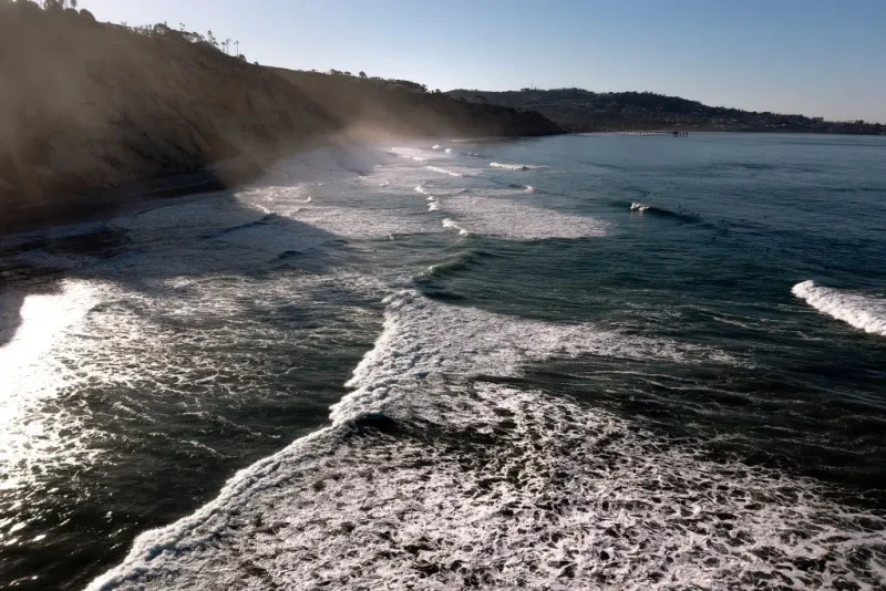 LA JOLLA, CALIFORNIA - JANUARY 09: In an aerial view, waves crash on Black's Beach on January 09, 2025 in La Jolla, California. (Photo by Sean M. Haffey/Getty Images)