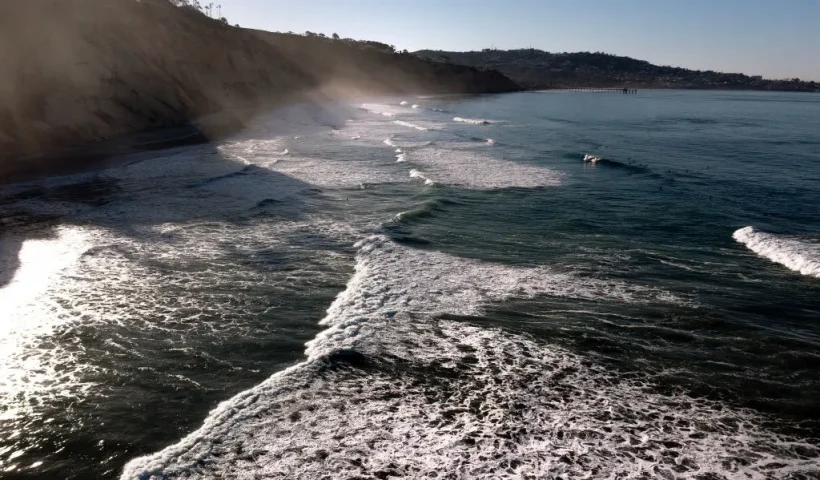 LA JOLLA, CALIFORNIA - JANUARY 09: In an aerial view, waves crash on Black's Beach on January 09, 2025 in La Jolla, California. (Photo by Sean M. Haffey/Getty Images)