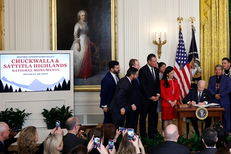 U.S. President Joe Biden signs proclamations creating the Chuckwalla National Monument and the Sáttítla Highlands National Monument in the East Room at the White House an on January 14, 2025 in Washington, DC. The designations will protect more than 848,000 acres of land in California, adding to Biden's legacy of setting aside more than 674 million acres of federal land. Biden was joined by Interior Secretary Deb Haaland and other lawmakers and native leaders. (Photo by Kevin Dietsch/Getty Images)