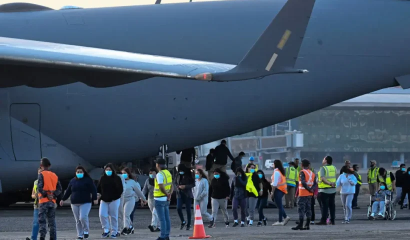 Guatemalan migrants deported from the United States on a U.S. military plane walk down the runway at the Guatemalan Air Force Base in Guatemala City on January 30, 2025. (Photo by JOHAN ORDONEZ / AFP) (Photo by JOHAN ORDONEZ/AFP via Getty Images)