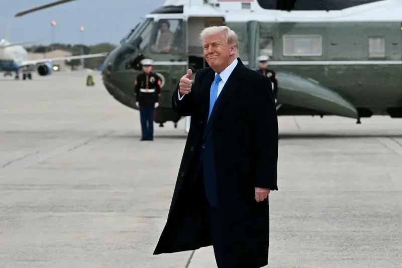 TOPSHOT - US President Donald Trump gives a thumbs up after stepping off Air Force One upon arrival at Joint Base Andrews in Maryland on April 6, 2025. Trump is returning to Washington, DC, after spending the weekend at his Mar-a-Lago Resort. (Photo by Mandel NGAN / AFP) (Photo by MANDEL NGAN/AFP via Getty Images)