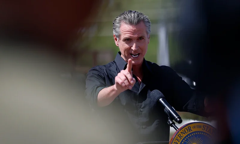 CERES, CALIFORNIA - APRIL 16: California Governor Gavin Newsom speaks during a news conference at Gemperle Orchard on April 16, 2025 in Ceres, California. Governor Gavin Newsom and California Attorney General Rob Bonta have filed a lawsuit in federal court challenging the Trump administration's use of emergency powers to enact sweeping tariffs that hurt states, consumers, and businesses. The tariffs have disrupted supply chains, increased costs for the state and Californians, and inflicted billions in damages on California’s economy, the fifth largest in the world. (Photo by Justin Sullivan/Getty Images)