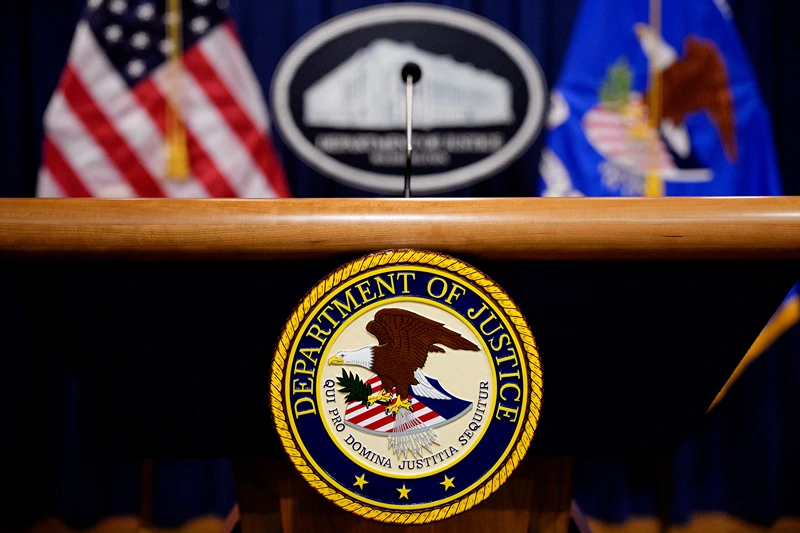 WASHINGTON, DC - MAY 6: The Department of Justice seal and logo are displayed before U.S. Attorney General Pam Bondi arrives for a news conference at the Department of Justice on May 6, 2025 in Washington, DC. The Justice Department along with the Drug Enforcement Administration (DEA) and the U.S. Attorney's Office for the District of New Mexico are set to announce that they have completed an operation targeting a large drug trafficking organization that has been dealing fentanyl and other illicit narcotics. (Photo by Andrew Harnik/Getty Images)