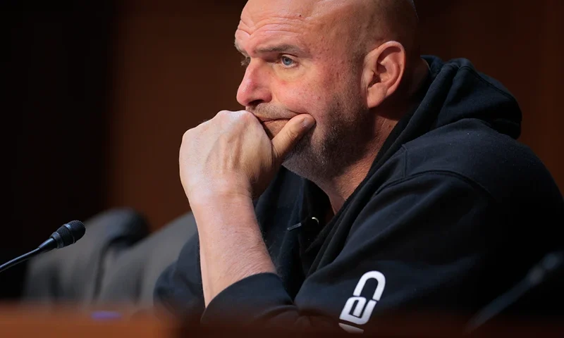 WASHINGTON, DC - MAY 08: Sen. John Fetterman (D-PA) questions tech leaders in artificial intelligence during a hearing of the Senate Committee on Commerce, Science, and Transportation in the Hart Senate Office Building on Capitol Hill on May 08, 2025 in Washington, DC. Tech leaders from OpenAI, Microsoft, Advanced Micro Devices (AMD) and CoreWeave testified about the global artificial intelligence race and how the United States can remain competitive. (Photo by Chip Somodevilla/Getty Images)