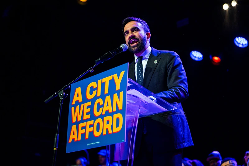 Zohran Mamdani speaks enthusiastically into the microphone at a rally at Brooklyn Steel in Brooklyn New York on May 4 2025. (Photo by Madison Swart / Hans Lucas / Hans Lucas via AFP) (Photo by MADISON SWART/Hans Lucas/AFP via Getty Images)