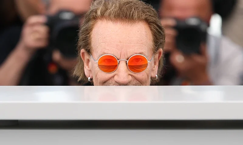 TOPSHOT - Irish singer of U2 Bono poses during a photocall for the film "Bono: Stories of Surrender" at the 78th edition of the Cannes Film Festival in Cannes, southern France, on May 17, 2025. (Photo by Sameer AL-DOUMY / AFP) (Photo by SAMEER AL-DOUMY/AFP via Getty Images)