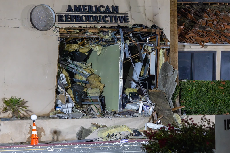 The damaged front of the American Reproductive Centers fertility clinic stands following a bomb blast on May 17, 2025 in Palm Springs, California. A suspected bomber is believed to have post a manifesto to social media before the explosion. One person was confirmed dead at the scene, according to police. (Photo by David McNew/Getty Images)