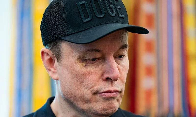 Elon Musk looks on during a news conference with US President Donald Trump in the Oval Office of the White House in Washington, DC, on May 30, 2025. Musk, who stormed into US politics as President Trump's chainsaw-brandishing sidekick, announced on May 28 that he is leaving his role in US government, intended to reduce federal spending, shortly after his first major break with the President over Trump's signature spending bill. (Photo by Allison ROBBERT / AFP) (Photo by ALLISON ROBBERT/AFP via Getty Images)