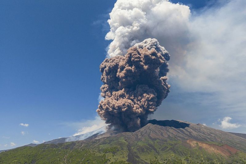 TOPSHOT - Smoke rises from the crater of the Etna volcano as it erupts, on Mount Etna near Catania on June 2, 2025. A huge plume of ash, gas and rock spewed forth on June 2, 2025, from Italy's Mount Etna, Europe's largest active volcano, after a portion of its southeastern crater likely collapsed, authorities said. (Photo by Giuseppe Distefano / AFP) (Photo by GIUSEPPE DISTEFANO/AFP via Getty Images)