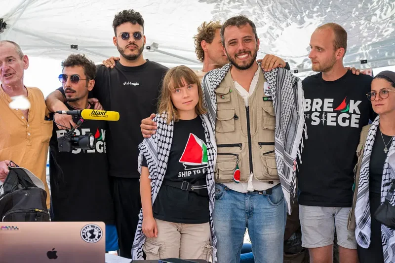 CATANIA, ITALY - JUNE 01: Greta Thunberg with part of the crew of the ship Madleen, shortly before departure for Gaza, during the press conference in San Giovanni Li Cuti on June 01, 2025 in Catania, Italy. Swedish activist Greta Thunberg is among those who will attempt to sail to Gaza on a boat organized by the Freedom Flotilla Coalition (FFC), in a bid to break Israel's blockade of the Palestinian territory. Freedom Flotilla had to abort a previous journey in early May after it said its boat came under attack by drones in international waters near Malta. (Photo by Fabrizio Villa/Getty Images)